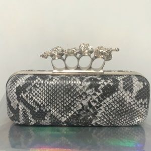 Knuckle snakeskin clutch purse